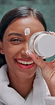 Cream, skincare and face with woman in bathroom for dermatology, beauty glow and cosmetics. Shine, makeup and collagen lotion with person at home with facial routine for self care, spa and cleaning