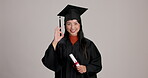 Certificate, graduation and okay with Japanese woman in studio on white background for perfection. Diploma, education or face of happy college or university student in cap and gown for success