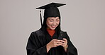Woman, university student and graduation with smartphone in studio background for social media in Japan. Female person, college learner and happy for achievement with message for congratulations