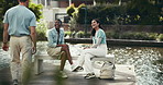 Friends, break or students greeting in park, campus or school for bonding, acceptance or community. Relax, outdoor or happy people with diversity or smile on bench talking for education in university