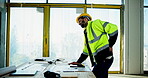 Architect, construction worker and back pain with drawing, plans and blueprints for maintenance. Architecture, tablet and design professional with sprain, schematics and remodeling for renovation