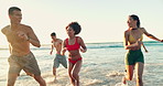 Laughing, friends and running in water at beach for travel adventure, summer vacation and fun on weekend trip. Freedom, diversity people and enjoyment by ocean with bonding, joke and playing together