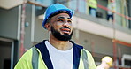 Outdoor, man and talking on radio at construction site for communication and connection for building project. Male person, employee and smile as engineer for inspection, supervision and architecture