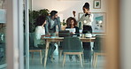 Paperwork, planning and business people in meeting for development, growth or collaboration. Teamwork, men and women in office together with laptop, documents or proposal discussion at digital agency