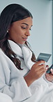Credit card, phone and woman in bedroom for sign up, information or ecommerce sale in home. Online shopping, loan and comfortable customer on bed with budget app, password or payment deal with robe