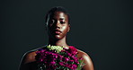 Black woman, natural beauty and face with roses with wellness, health and glow from skincare routine. Studio, cosmetics and mockup space with eco, flowers and floral with plant and dark background
