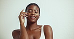 Fabric, black woman and skincare with relax, health and soft skin with silk or eco cotton sheet. Studio, art and sustainable cosmetics with beauty and glow from treatment and white background