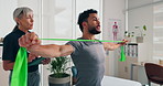 Resistance band, stretching and physiotherapist with man on tablet for rehabilitation, recovery or consulting. Health, medical service and woman with client for physical therapy, strength or wellness