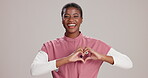 Studio, black woman and nurse with love sign or smile for healthcare support, care and trust on white background. Female person, medical profession and happy with heart symbol for help and wellness