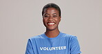 Black woman, face and happy in studio as volunteer with pride and confidence for community service in Kenya. Female person, white background and smile or satisfied with NGO for charity and support