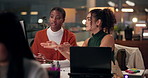 Night, design team and computer in office for advice, website layout and brainstorming. Women, tech or discussion in digital agency for problem solving, planning campaign or deadline for productivity