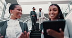 Networking, escalator and low angle with business people at convention for conversation, networking or client proposal. Feedback, talking and report with employees for advisor, teamwork or discussion