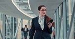 Business, woman and walking with phone in office for checking notifications, social networking or research. Professional, employee or commute to meeting in hallway with smartphone for online schedule