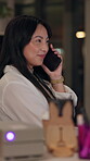 Night, woman and phone call in office for creativity, project feedback or friendly discussion. Graphic designer, smile or tech in agency for chat, deadline update or brainstorming for web development