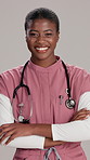 Laughing doctor, face and woman with arms crossed for funny healthcare service, medical support or pride. Pediatrician, black person and happy on studio background for health career or pediatric help