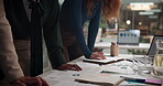 People, paper and meeting in office for planning, campaign strategy or teamwork with sticky notes. Employees, hands or documents in workplace for discussion, reminders or budget information in agency