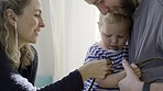 Father, baby and stethoscope of pediatrician for healthcare consultation, check lungs for breathing and heartbeat. Doctor, infant and assessment in clinic or hospital for medical analysis