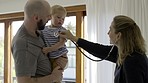 Father, baby and stethoscope of pediatrician for healthcare consultation, check lungs for breathing and heartbeat. Doctor, infant and assessment in clinic or hospital for medical analysis