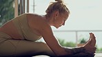 Woman, stretching legs and yoga with workout at home, balance and health with zen and fitness. Training, wellness and spiritual exercise in apartment, female yogi and pilates with body and flexible
