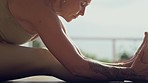 Stretching, yoga and flexibility with fitness, pascimottanasana pose and workout on home floor. Warm up, exercise and spiritual, female yogi is calm with balance and healing, health and wellness
