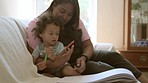 Relax, baby or mother reading a book for learning, education or creative storytelling on sofa at home. Family, love or parent with a young child for a fantasy story to enjoy quality time together