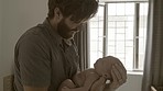Father with baby, love and family with bonding for relationship, hug and cuddle child at home. Man rock newborn to sleep, new dad and affection with care in bedroom