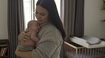 Mother with baby, love and family with bonding for relationship, hug and cuddle child at home. Woman rock newborn to sleep, new mom and affection with care in bedroom