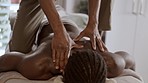Black man, back and deep tissue massage in spa for healthy wellness, stress relief or relax at resort. Hands of male person or masseuse massaging muscles for relaxation, zen or calm body treatment