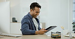 Smile, businessman at desk with tablet for social media post, research for online article or feedback. Reading, website search and happy man in office checking good news, business report or review.