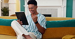 Scroll, success and tablet with man on sofa for online reading, good news and social media post. Networking update, winner and streaming with person in living room at home for app and scroll