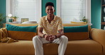 Home, confident or face of man on sofa with smile for wellness, weekend or break in living room. Relax, chilling or happy person with modern apartment for comfort, resting or pride on couch in France
