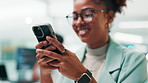 Happy woman, web designer or typing with phone for UI, UX or app development at office. Female person, programmer or software developer with smile on mobile smartphone for online testing or AI design