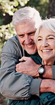 Mature, happy couple or hiking with hug for love, adventure or outdoor journey together in nature. Senior, man or woman with smile, embrace or care for romance, trip or exploration in forest or woods