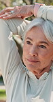Stretching, mature woman and exercise in nature, outdoor and training for wellness in retirement at park. Serious, retired and workout for health of senior person, performance and active in morning