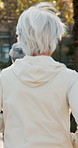 Senior, back and running with friends for fitness, cardio exercise or outdoor workout together. Elderly, people or group of runners with team for training, health and wellness in nature or park