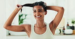 Beauty, morning routine and ponytail with Indian woman in home for keratin results or volume. Conditioner, hair and shampoo with happy person in apartment with natural and organic growth treatment