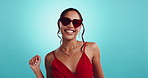Woman, heart sunglasses and dance in studio, fashion accessory and trendy outfit on blue background. Laughing, valentines day aesthetic and female person for designer style, shades and clothing