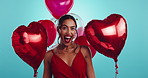 Love, balloons and happy woman in studio with excited celebration, gift or valentines day giveaway. Red shape, romantic offer and face of girl with heart emoji, present and smile on blue background