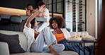 Television, conversation and women on sofa with gossip for movie, documentary or show at home. Living room, snack and friends discussion on couch for bonding and relax with streaming subscription