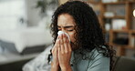 Blowing nose, tissue and sick with woman on sofa for flu season, pneumonia infection and illness. Hayfever, sneeze and allergy with person in living room at home for recovery, disease and cold