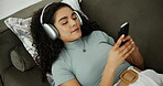 Streaming, headphones and woman with smartphone, relax and listening to sound with tech and subscription. Online, entertainment and person with movies, browsing and home on break with social media