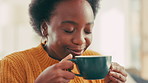 Tea, smell or happy black woman in home to relax on lounge sofa for cup scent and satisfaction. Cappuccino, smile or cozy African person drinking warm beverage or coffee for wellness break in Nigeria