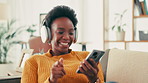 Dance, music and phone with black woman on sofa in living room of home for radio streaming. App, energy and headphones with smile of happy person listening to audio track in apartment on weekend