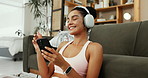Happy woman, fitness and listening with headphones for music, audio streaming or podcast at home. Active, female person or smile with mobile smartphone for online subscription or radio app at house