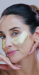 Skincare, woman or face with eye patches in studio for hydration, wrinkles reduction or hyaluronic acid. Beauty routine, person or hydrogel for dark circles, self care or collagen on white background