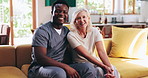 Senior, happy woman and nursing with hug on sofa for healthcare, wellness or assisted living at old age home. Portrait, interracial and caregiver with elderly patient or smile for retirement support