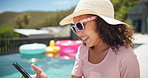 Happy, little girl or typing with phone by pool for fun summer, holiday or vacation at luxury resort. Child, kid or youth with smile on mobile smartphone for swimming trip, travel app or social media