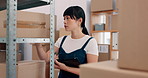 Tablet, supply chain and woman in warehouse by boxes with online inventory, checklist or order. Digital technology, cargo and female distributor reading parcel information for package shipping.