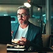Dinner, mature man and computer with overtime for coding, programing ...