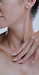 Hands, cosmetics and skincare with neck in studio for touch, change or process for dermatology by background. Person, model and check for anti aging, beauty and wrinkles for results with natural glow